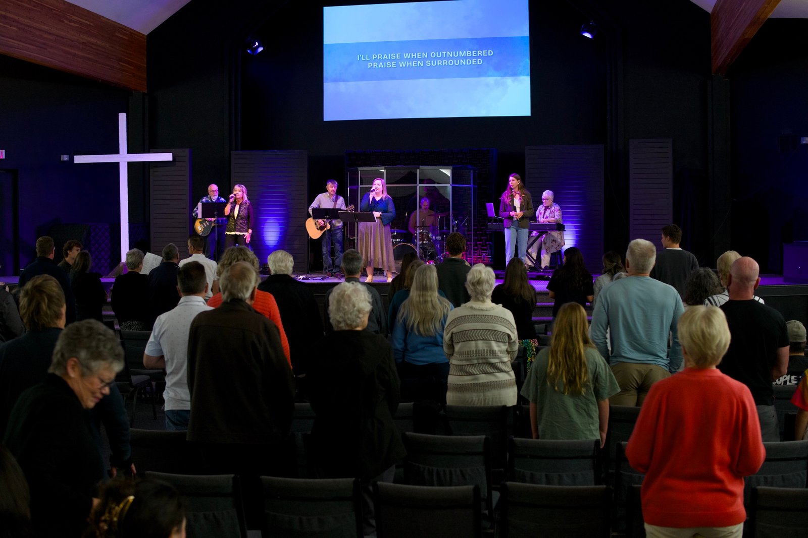 Westwood Church congregation standing in worship during a Sunday service