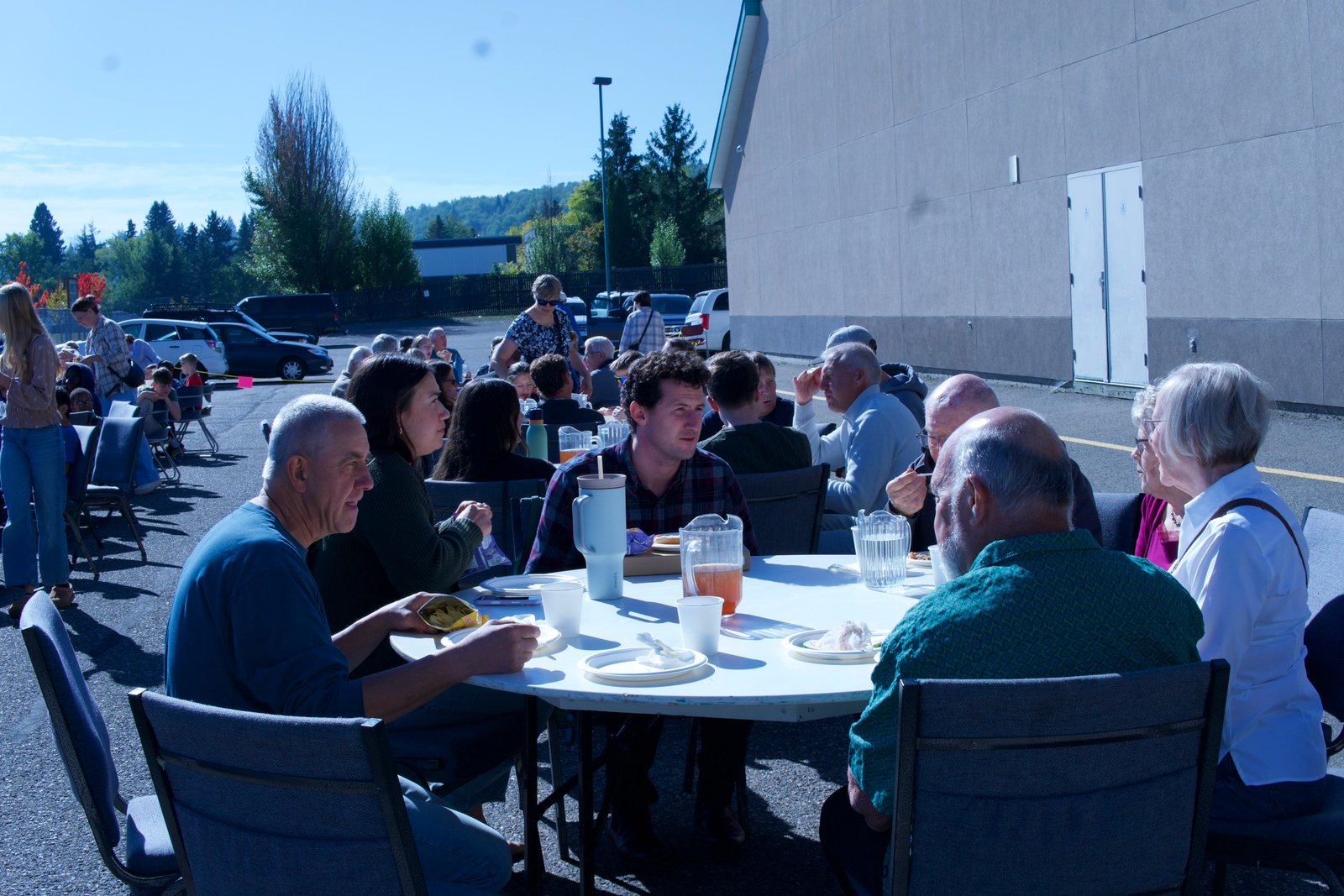 Eating together outside at the Vision Sunday BBQ