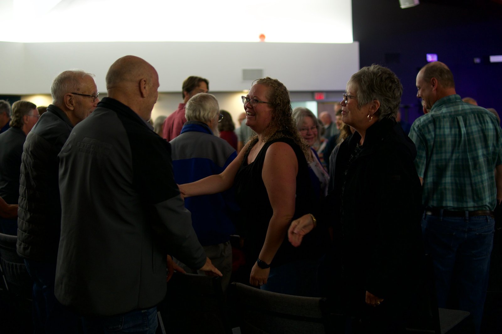 People greeting each other and laughing on a Sunday at Westwood